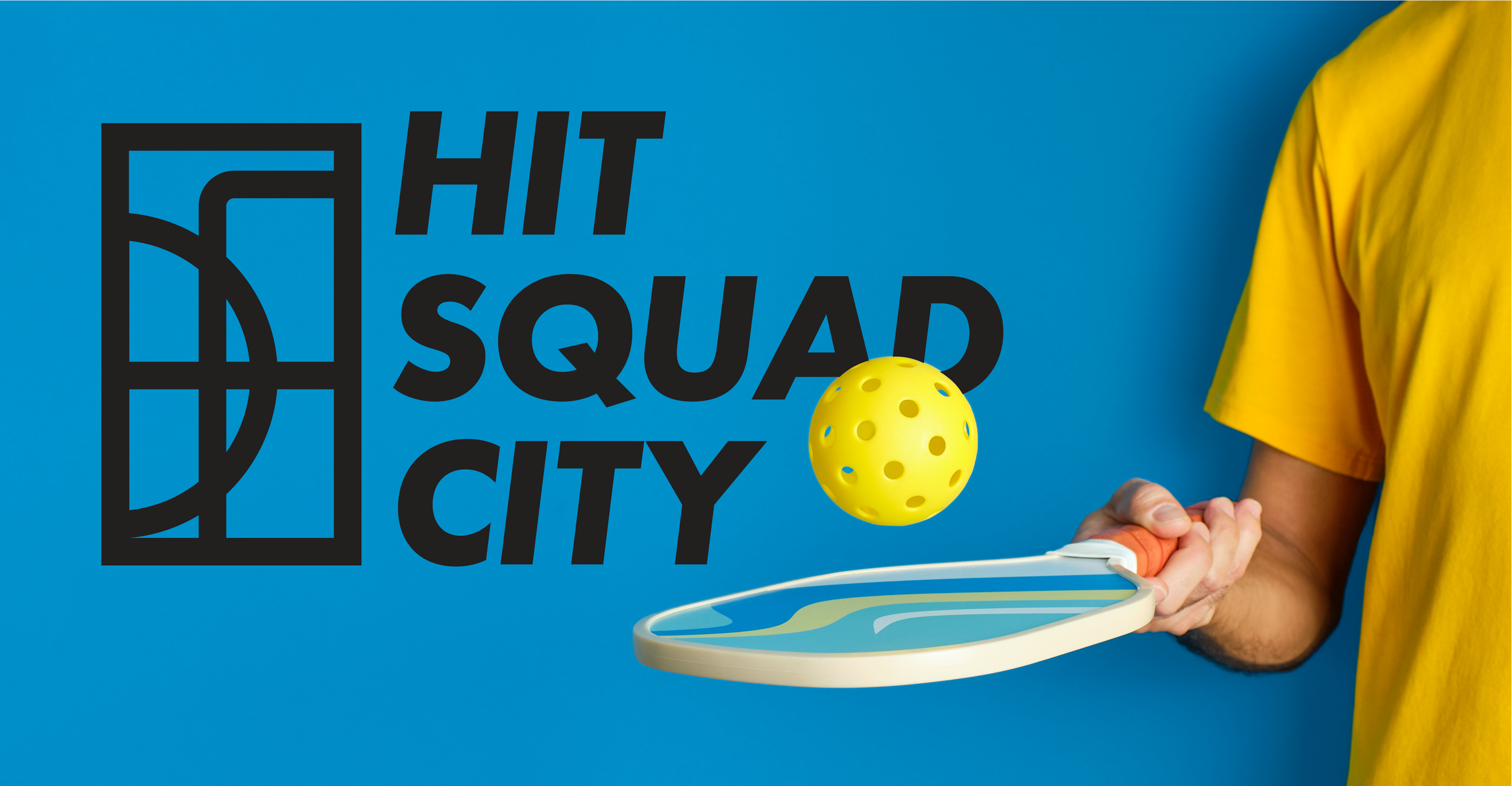 Person holding a Pickleball paddle hitting a yellow ball with holes in front of a blue wall with the text 'Hit Squad City' and a sports court graphic.