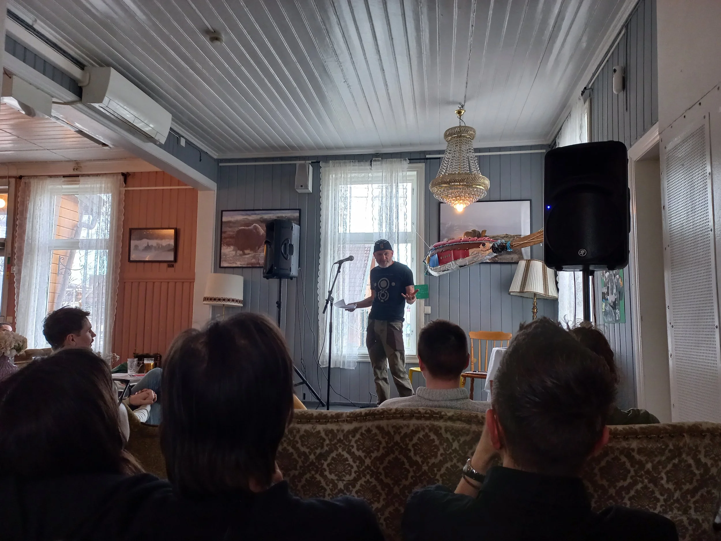 Borge Bringsværd telling the "Big Fish" story and sharing his father's sculpture of a fish made from trash found on the beach of the Oslo Fjord