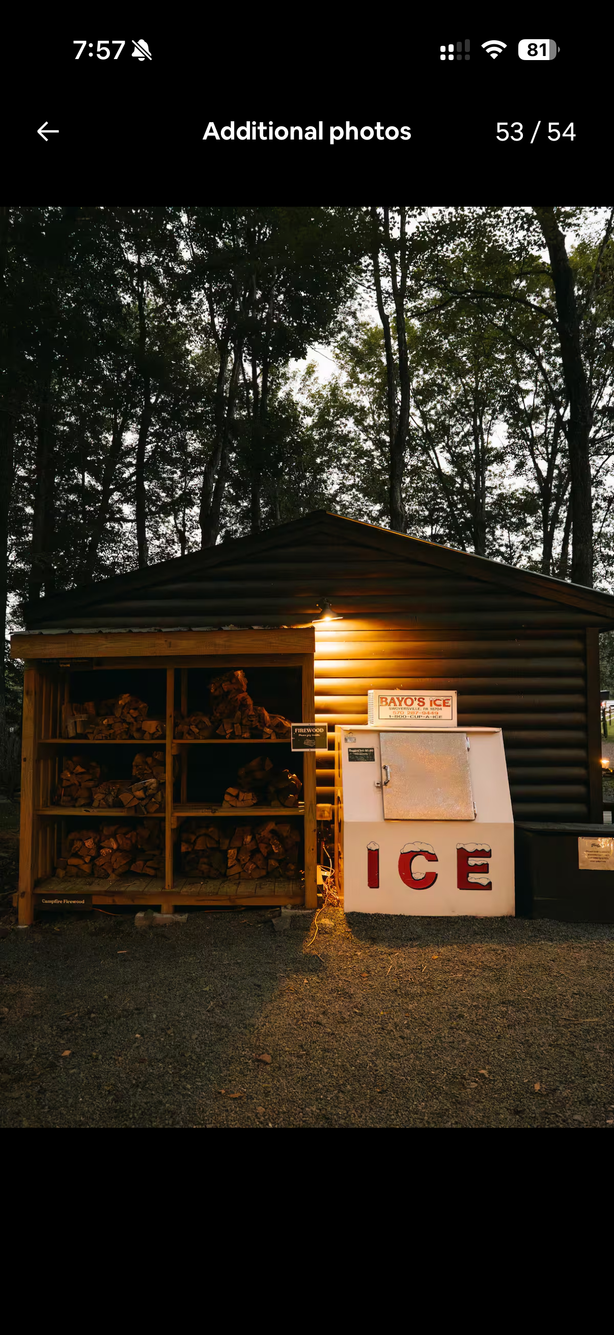 A warmly lit camp store at dusk
