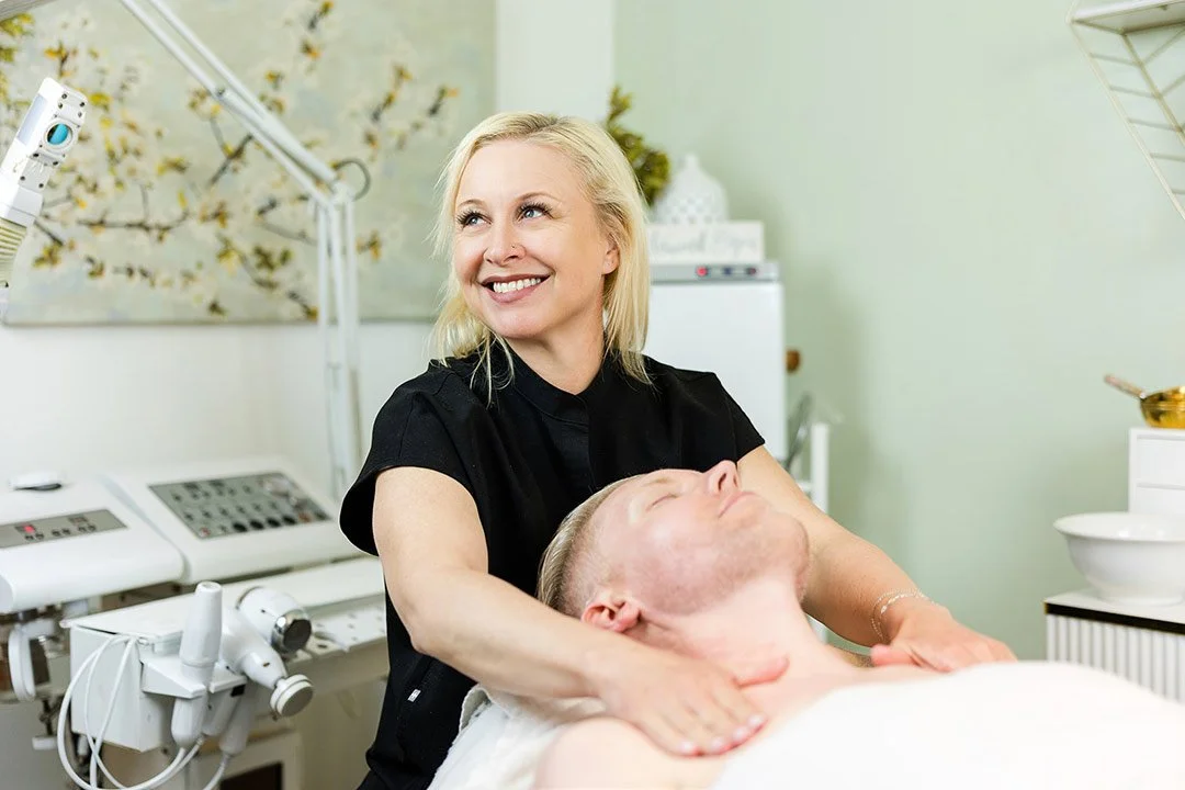 Esthetician performing a men's facial in Bend, Oregon