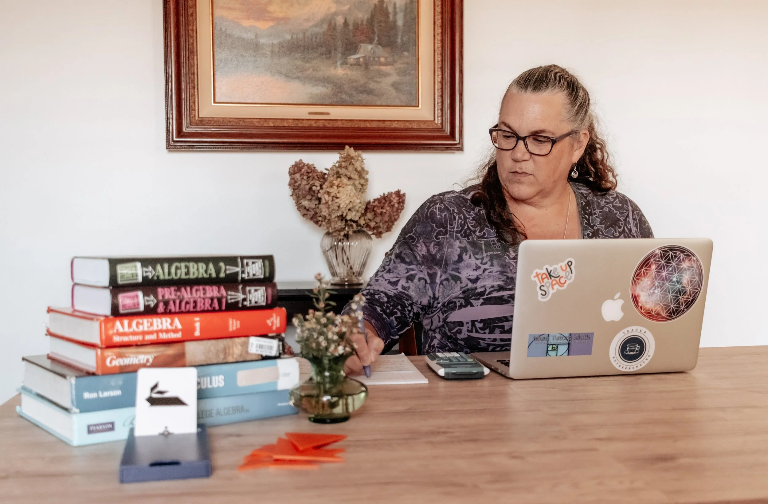 Math tutor preparing an individualized lesson using Algebra and Geometry resources — Mum Tutors Math