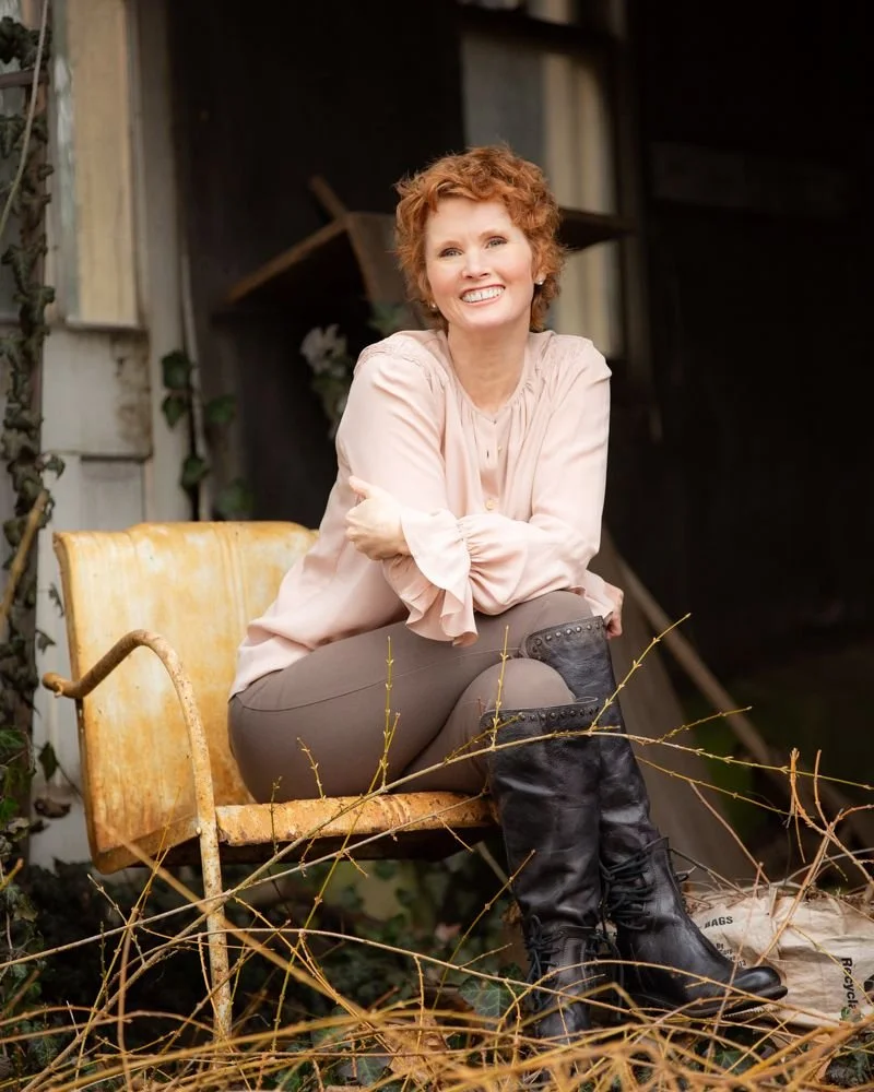 Angela McKinney sitting on chair on porch