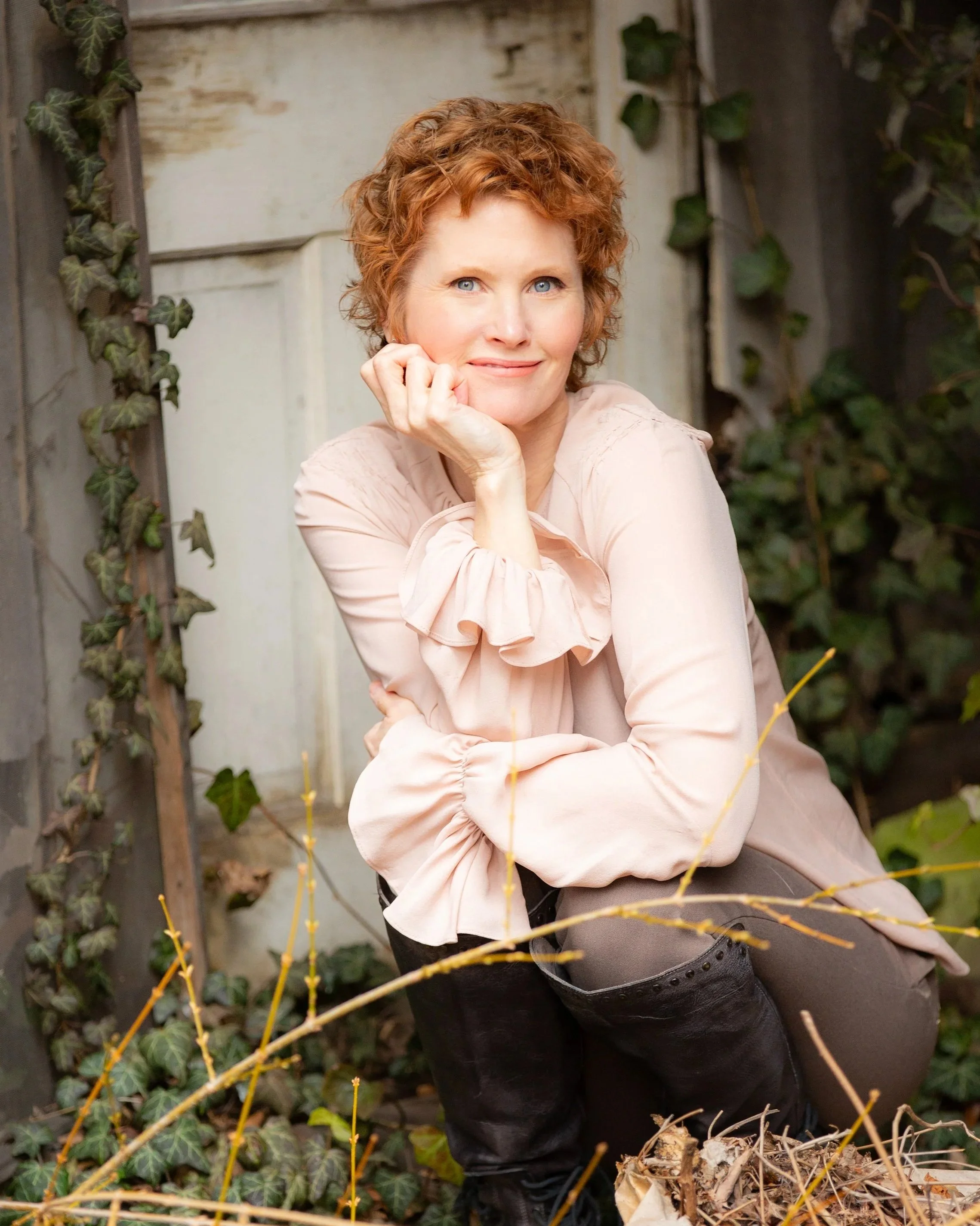 Angela McKinney, founder of Untangle and Thrive, sitting in nature