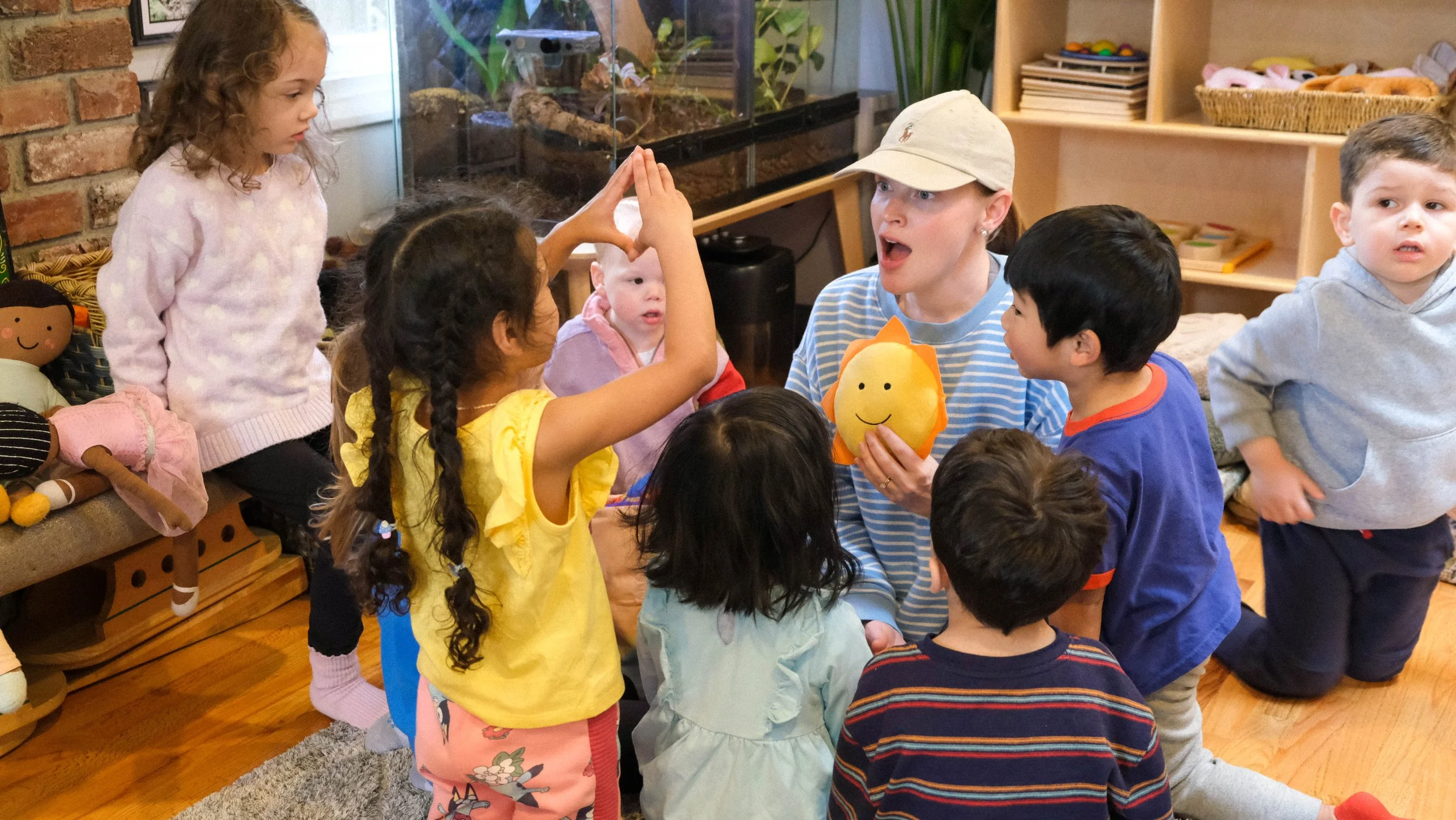 Toddlers experience hands on learning with Stretch and Grow Yoga teacher at Global Early Learning in Bellevue, Washington.