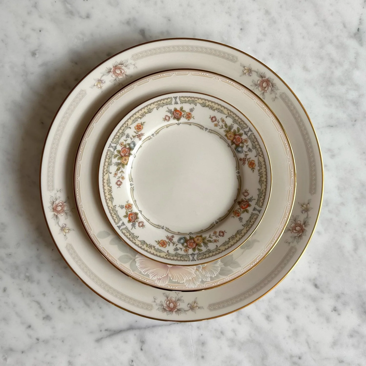 Luxurious vintage china dish set including dinner, salad, and bread & butter plate with floral trimmings. B&B can also be used as luxury cake plates.
