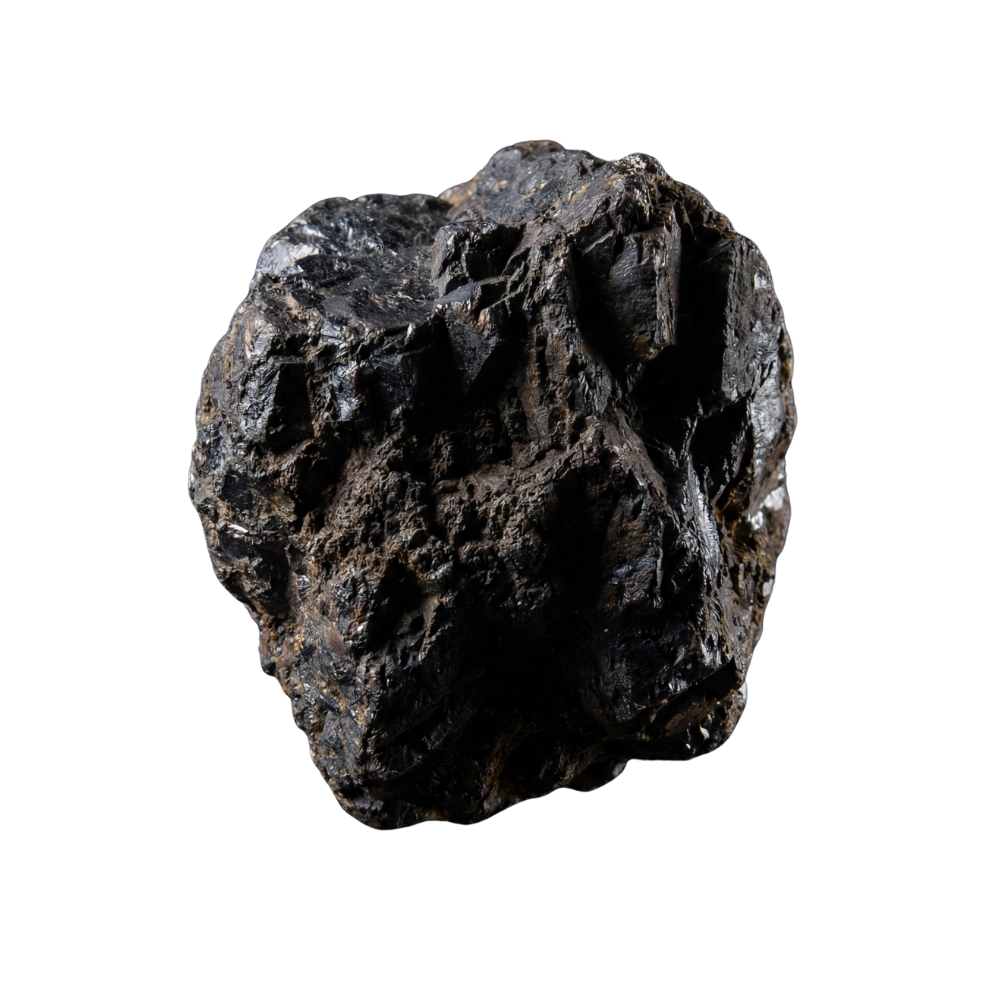 Close-up of a rough, black meteorite with a textured, uneven surface against a black background.