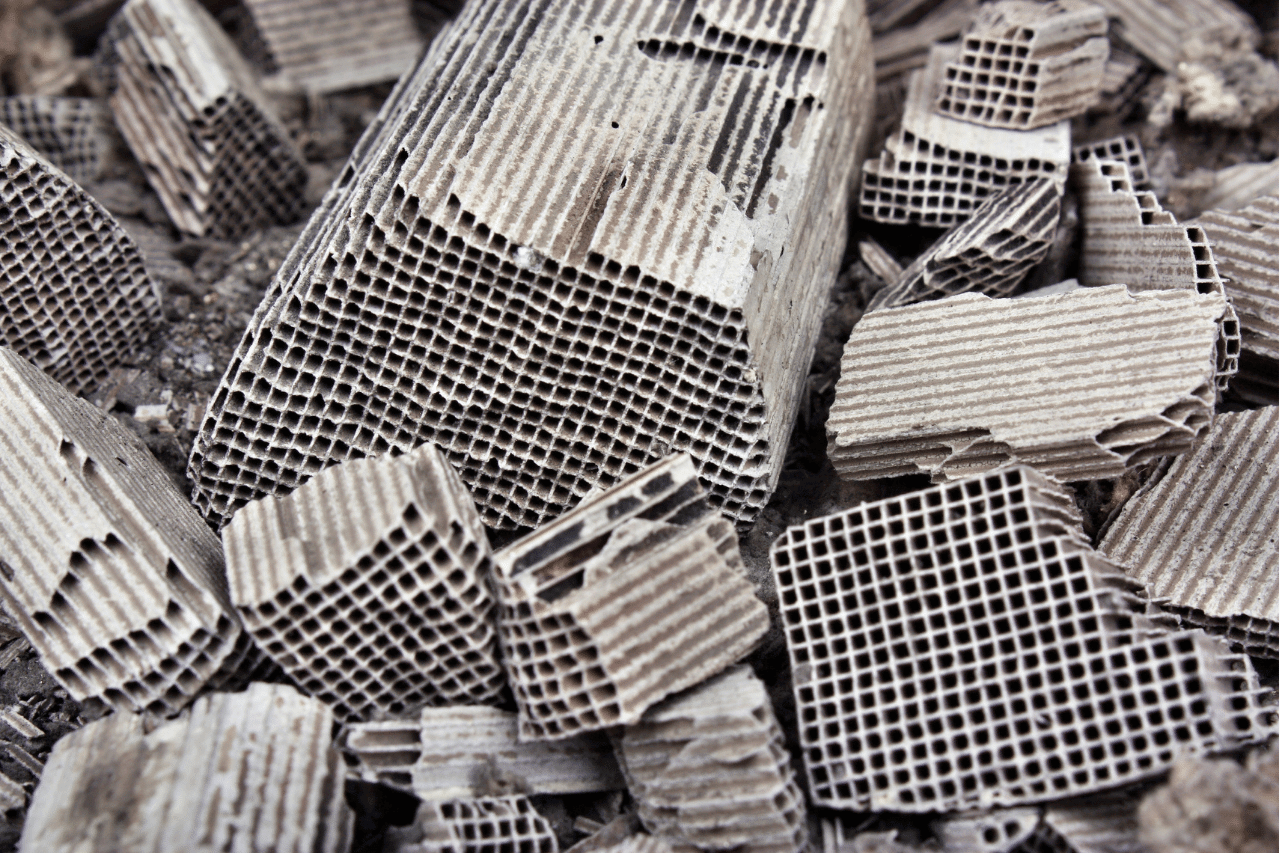 Close-up of broken pieces of corrugated cardboard with a grid pattern.
