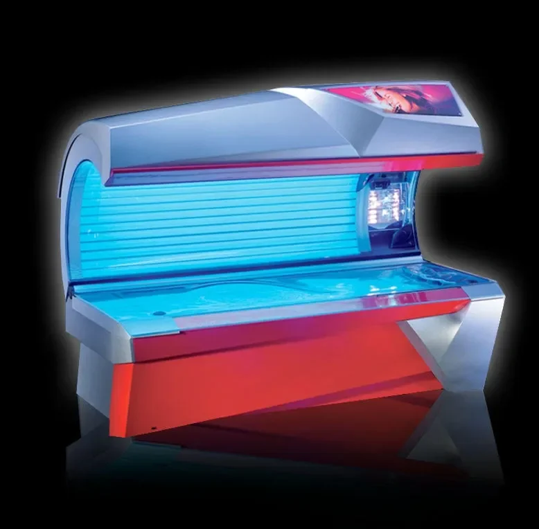 A modern tanning bed illuminated with blue and red lights, set against a black background.