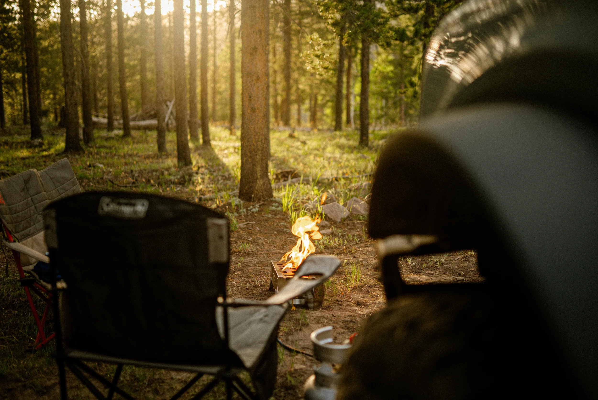 howl campfire in a cozy camp setup
