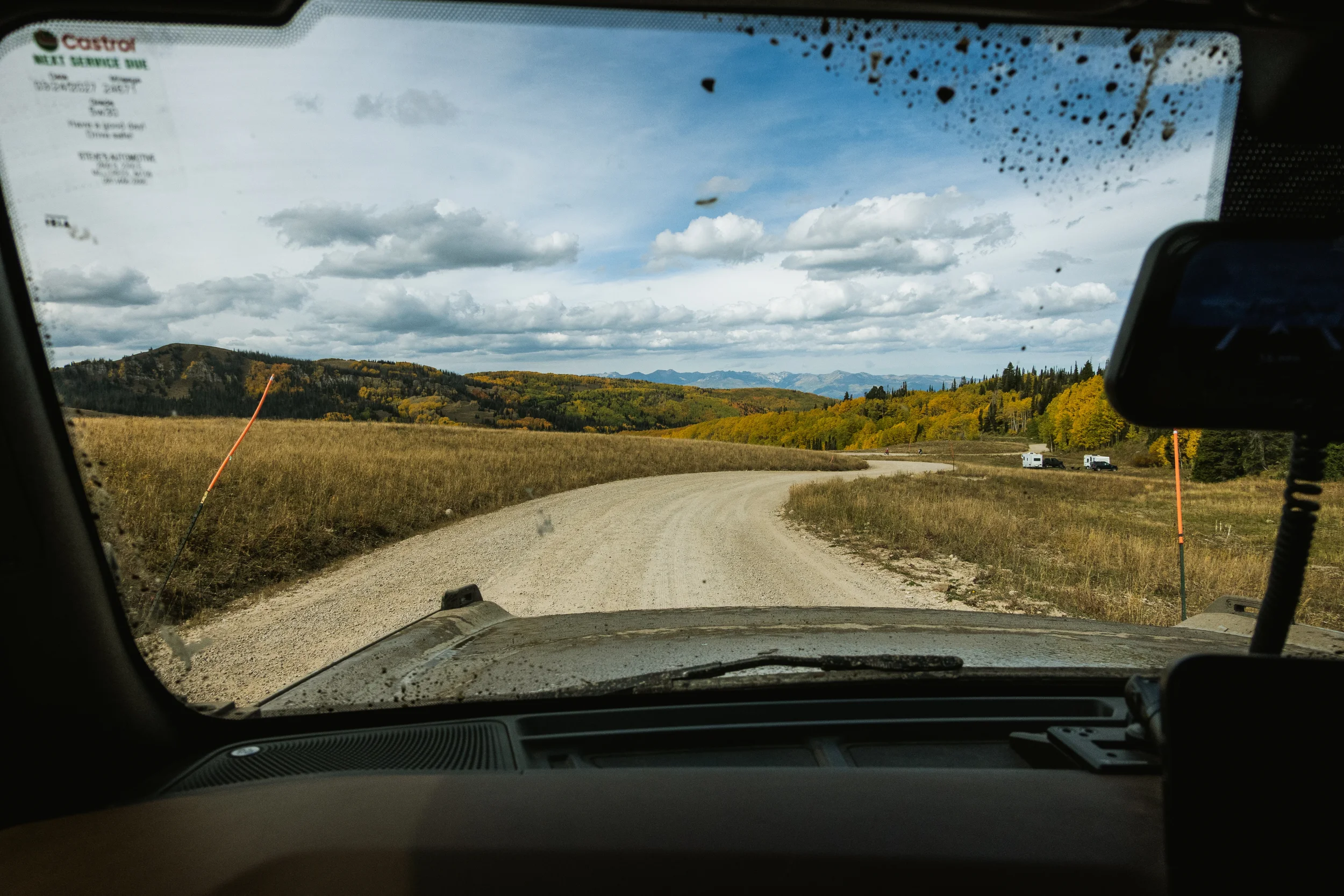 windhsield view driving on a dirt road