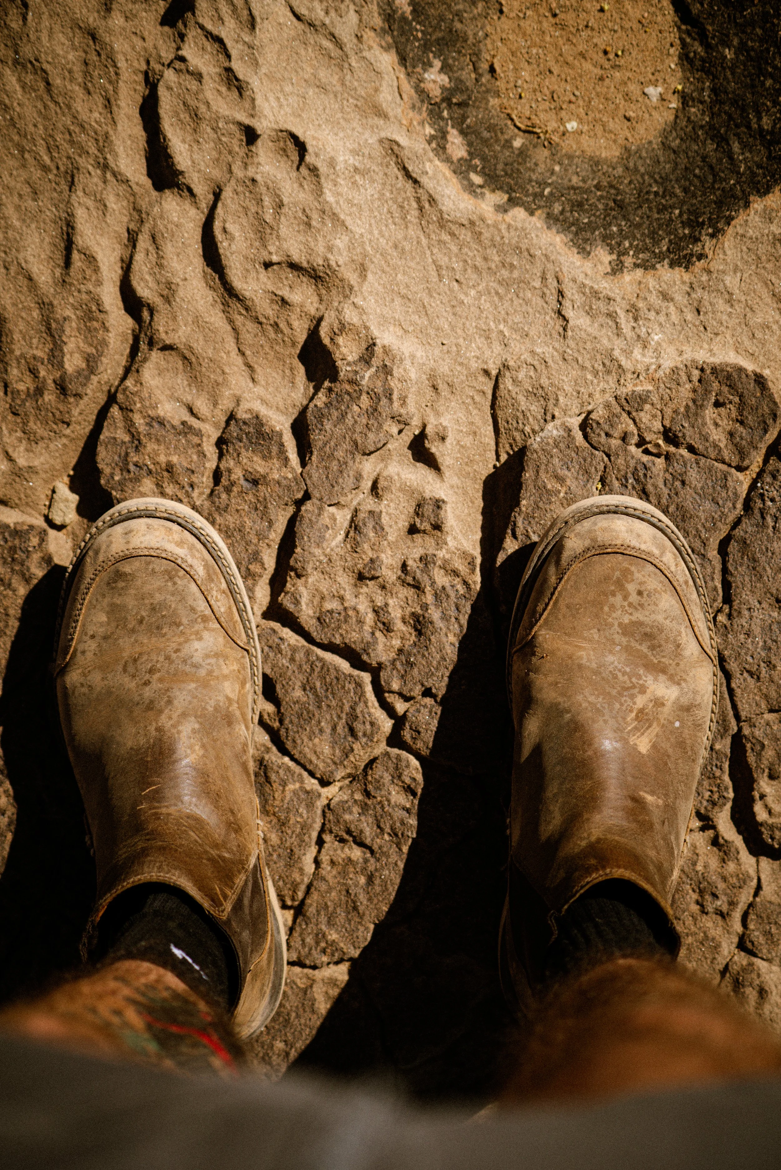 sandstone slab with boots