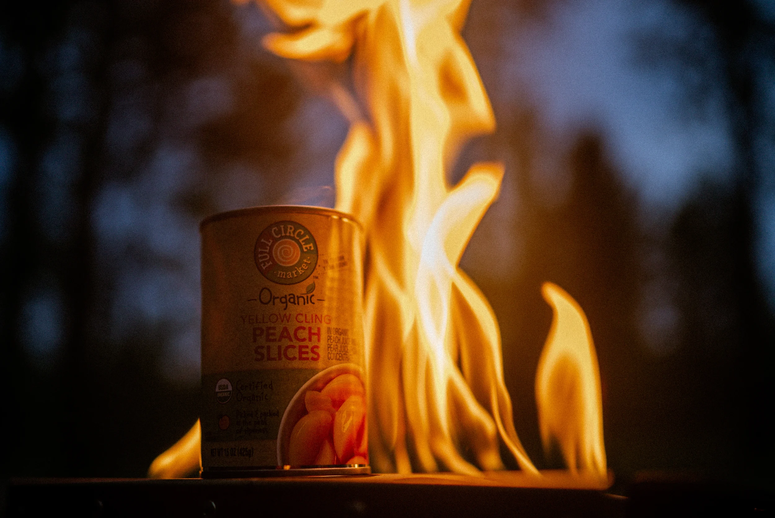 can of peaches on a fire