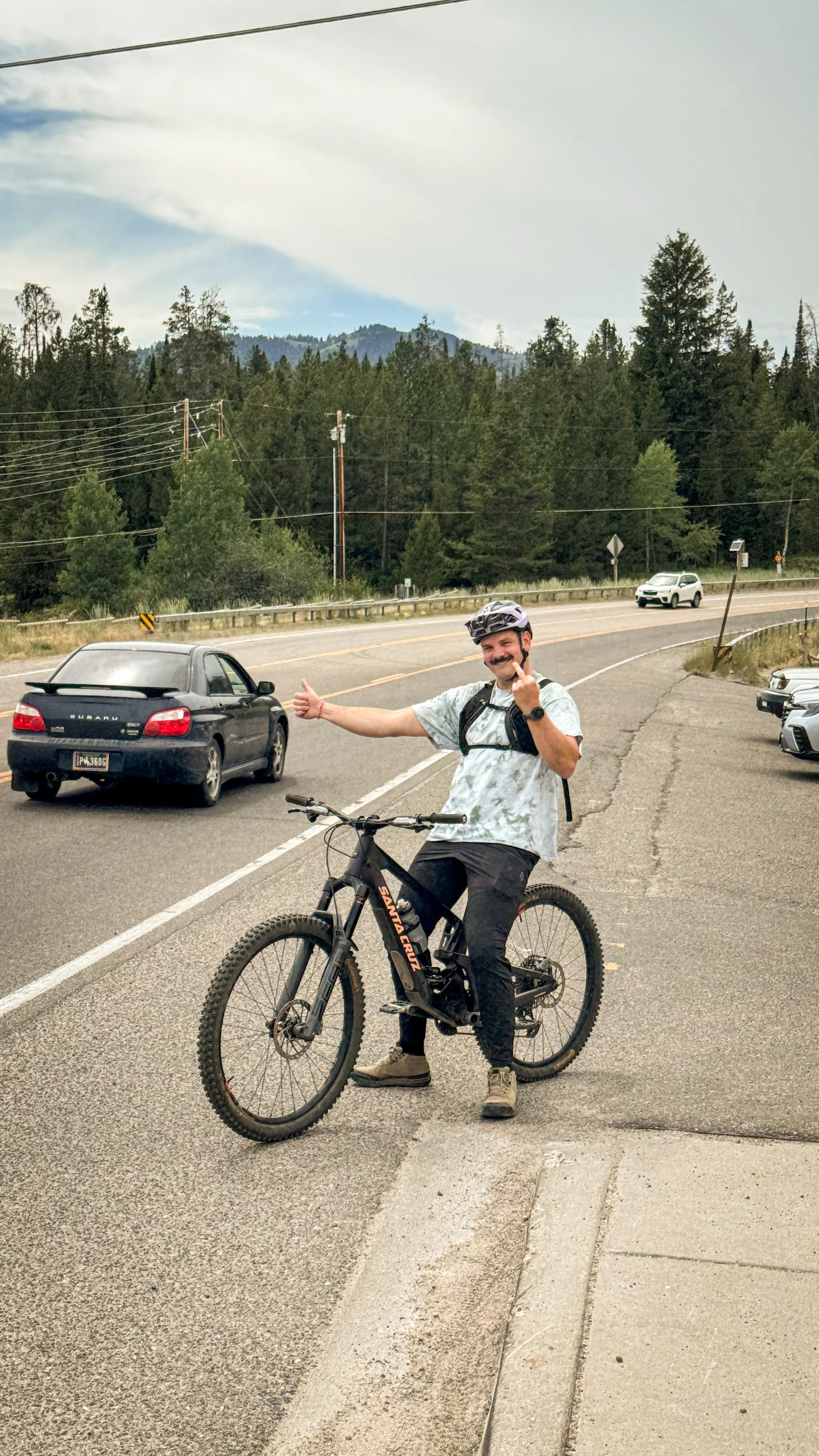 man with bike hitchhiking