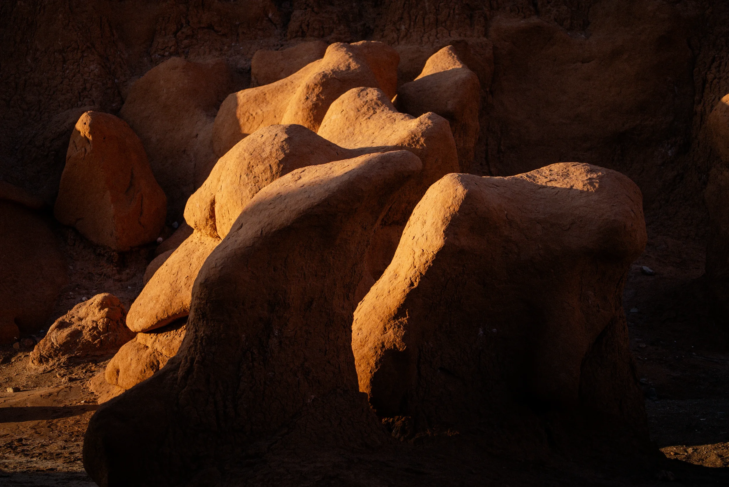 goblin valley hoodoos in warm sunset light