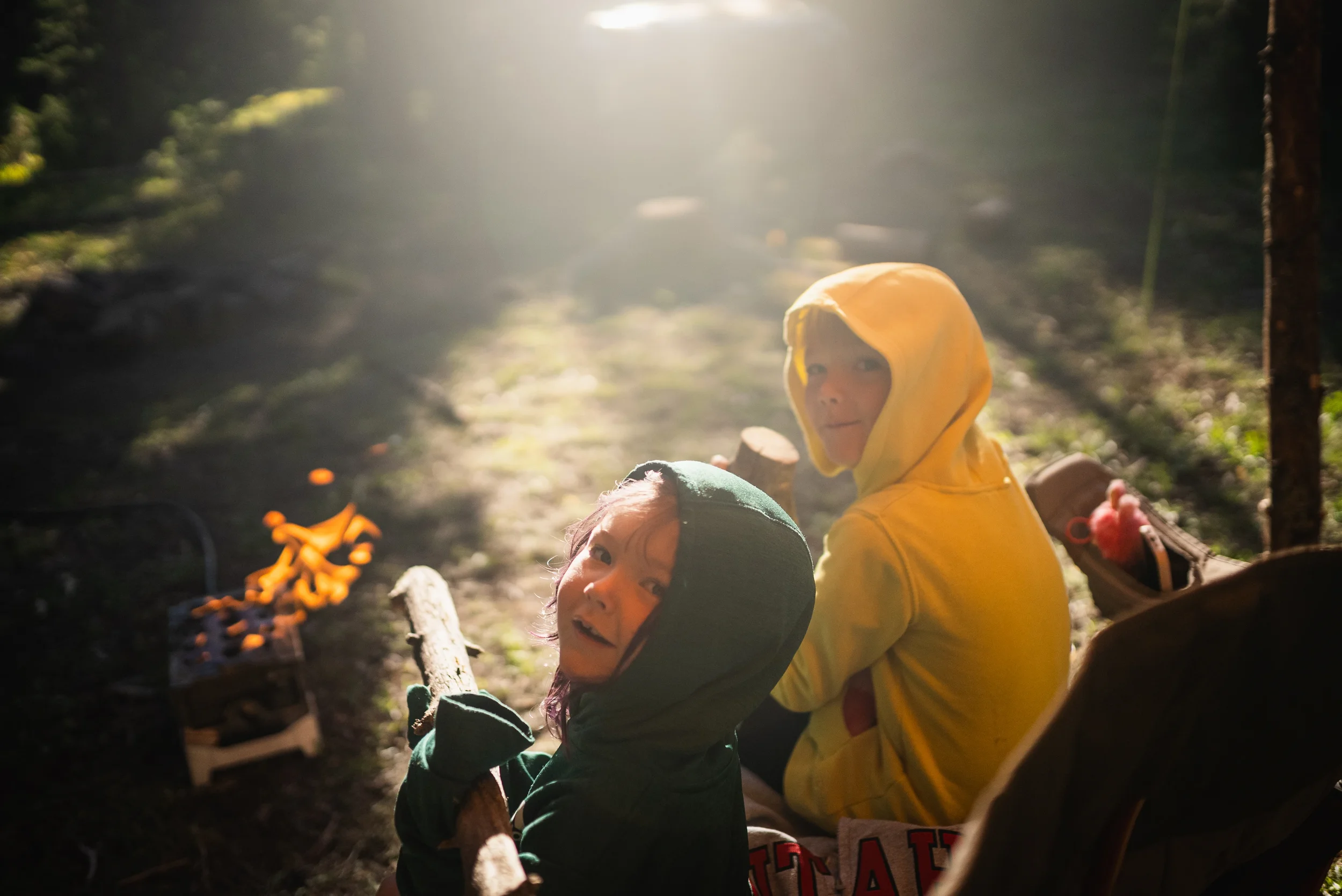 kids playing with sticks at camp