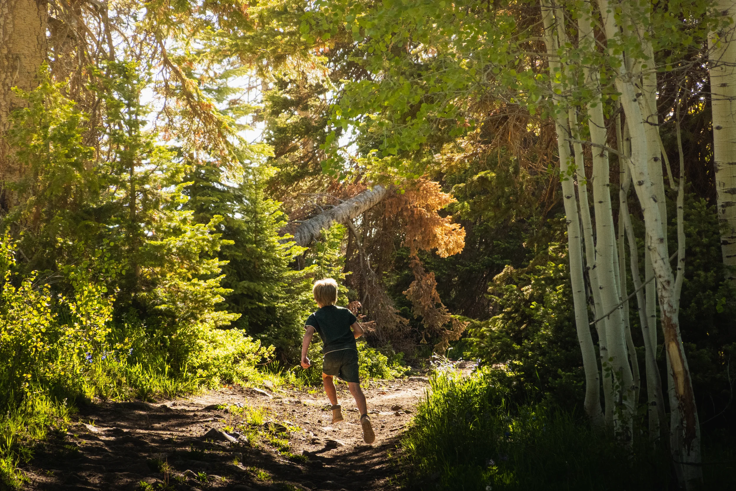 child running down a dirt road
