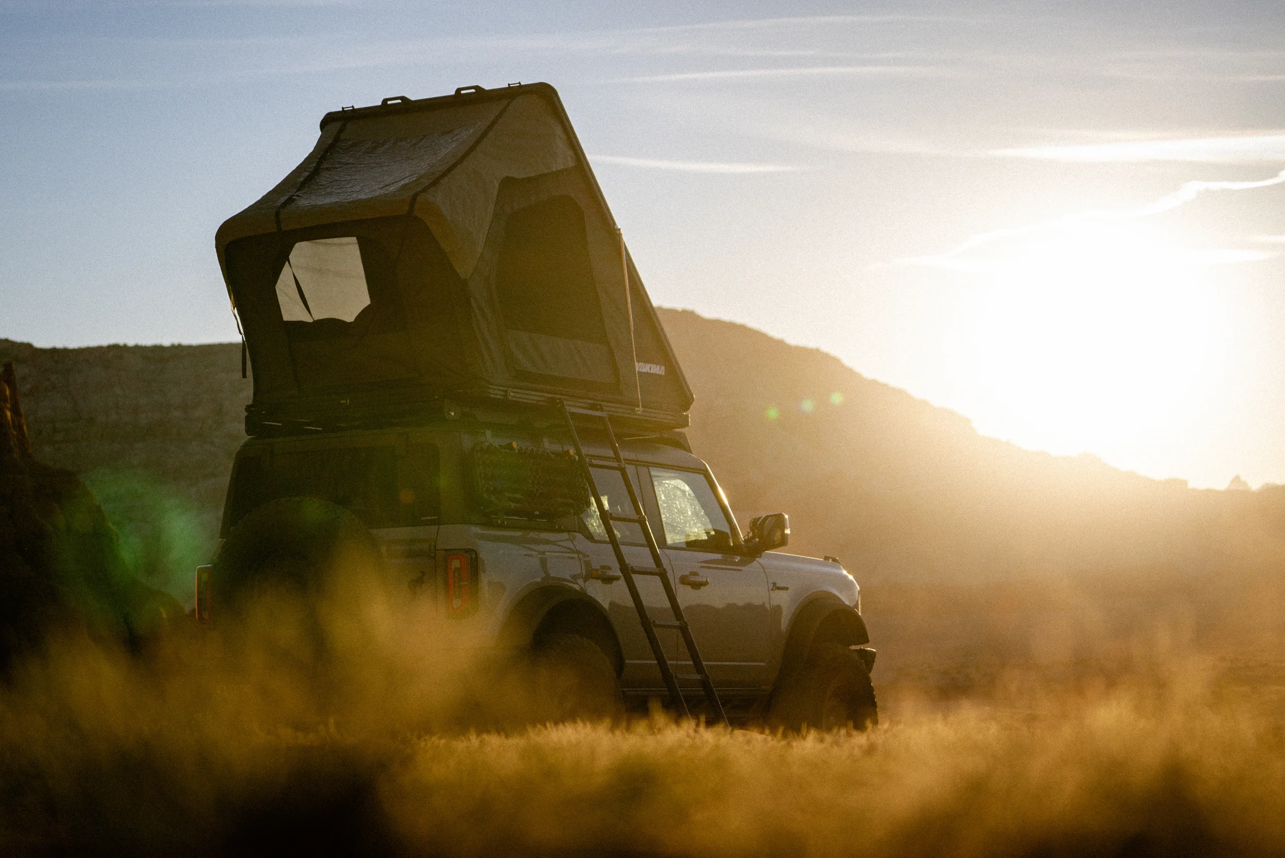 ford bronco with yakima tent in warm sunset glow