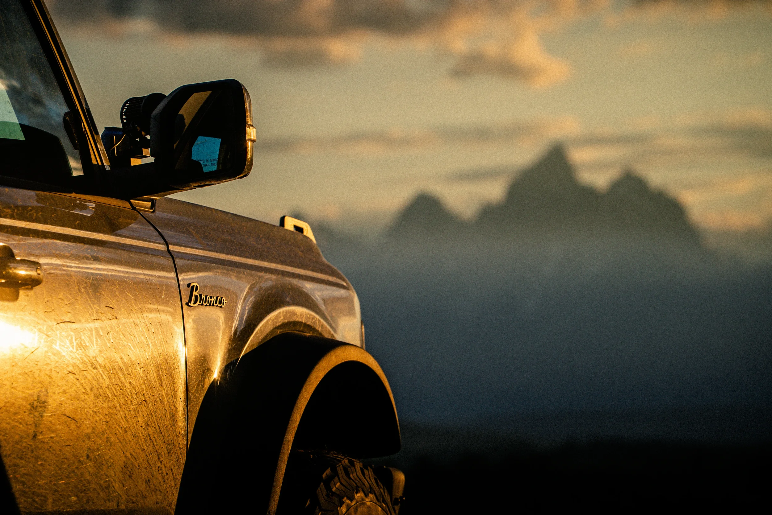 ford bronco during sunset in the tetons