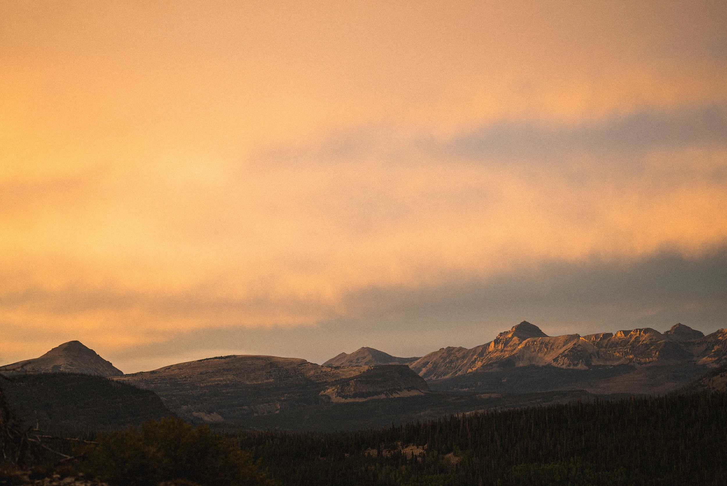 warm orange clouds over uinta mountains