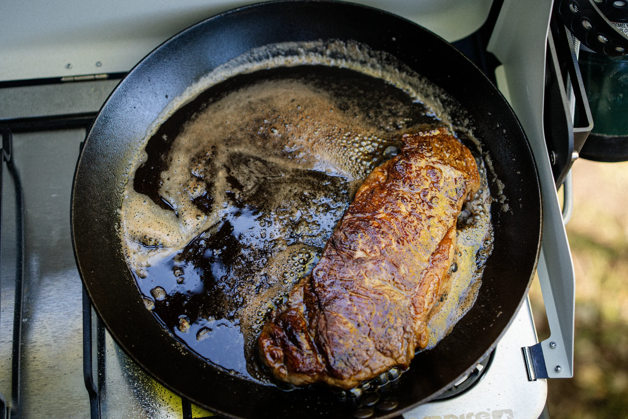 steak in a cast iron pan