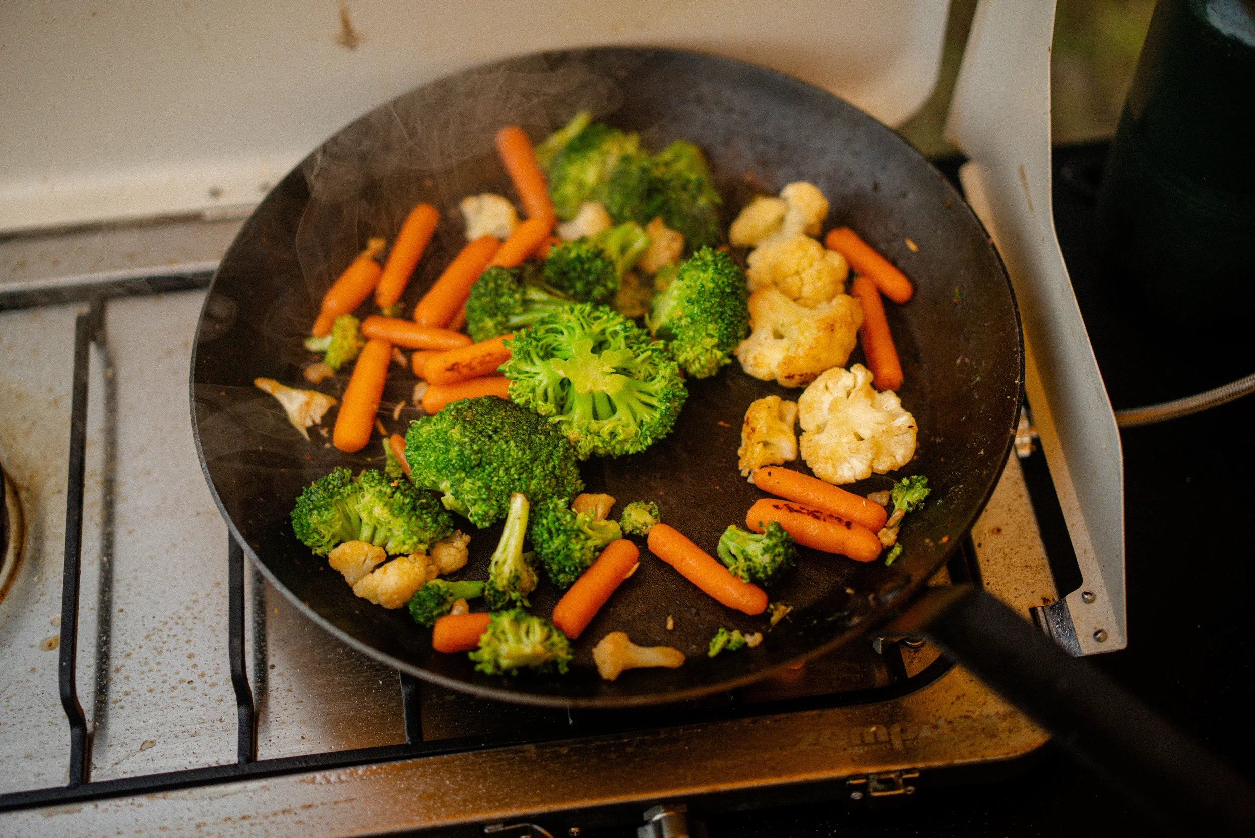 stir fry vegetables in a carbon steel pan