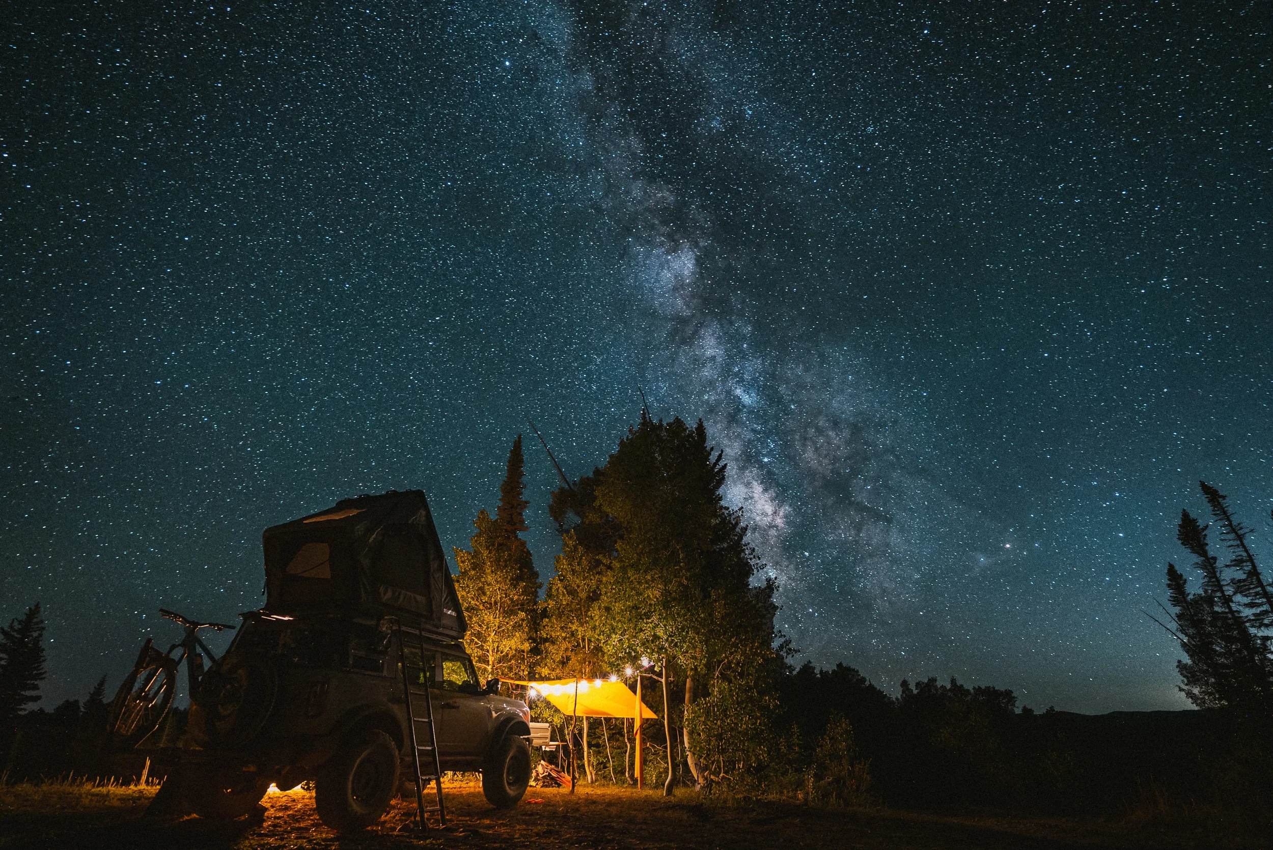 milky way over an overland campsite