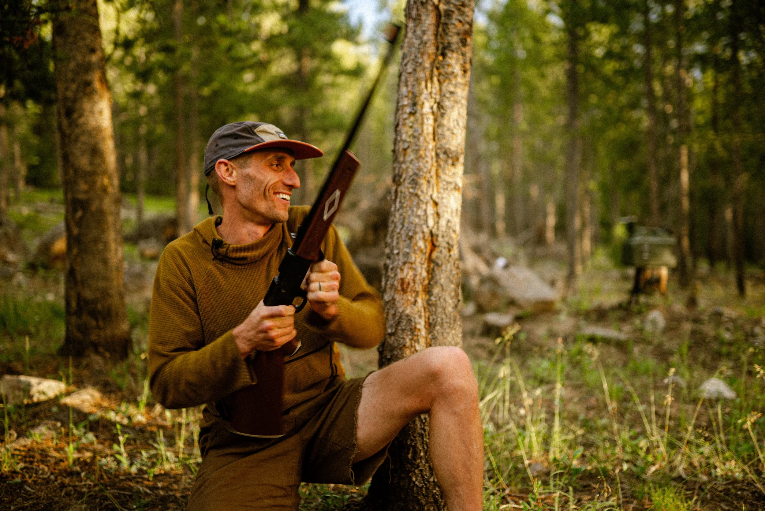 man reloading a bb gun while laughing