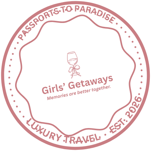 A circular wine-themed logo with the words 'Girls' Getaways,' 'Memories are better together,' and country-specific details such as 'Passport to Paradise,' 'Luxury Travel,' and 'Est. 2026,' surrounding a small illustration of a wine glass with a bow.