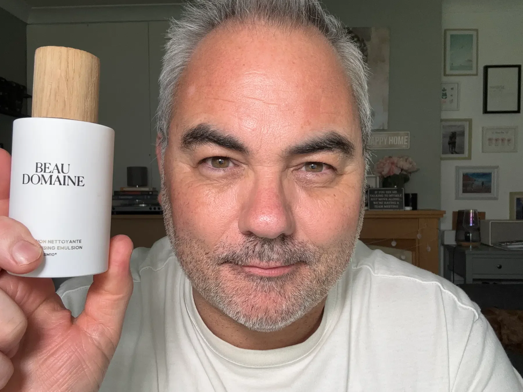 Jerome holding the Beau Domaine Cleansing Emulsion, explaining how to apply it to dry skin for a deep but non-stripping cleanse.