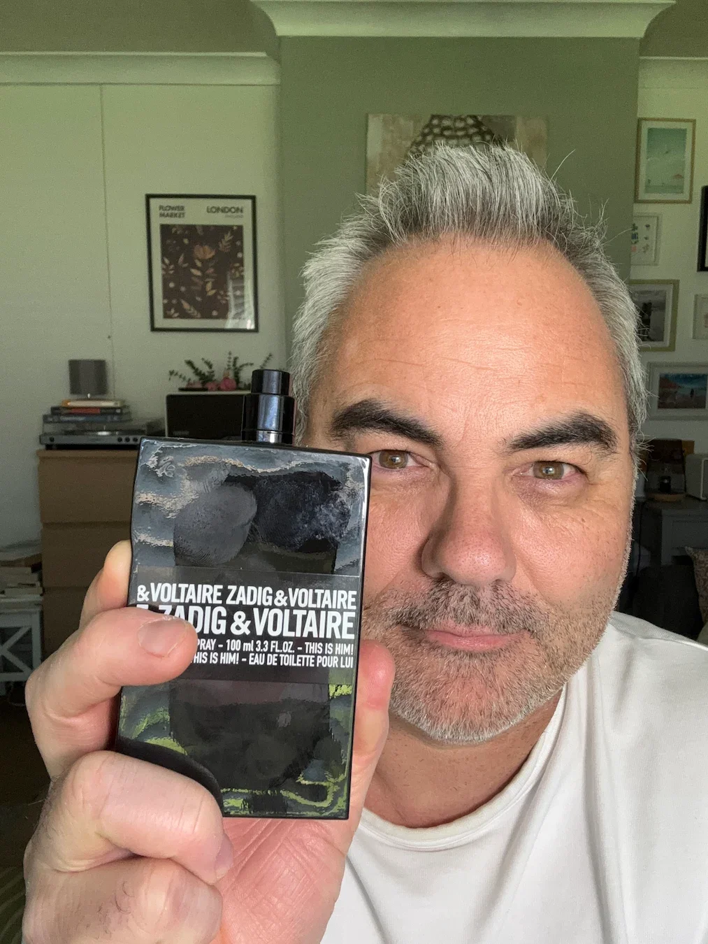 Jerome holding a 100ml bottle of Zadig & Voltaire This is Him! Eau de Toilette, discussing fragrance projection and sillage for men over 50.