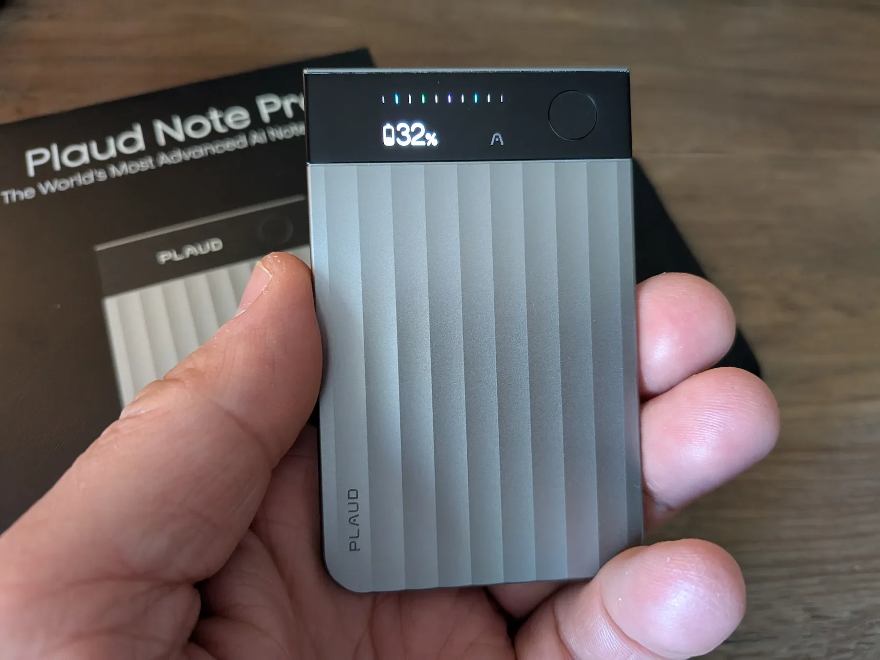 PLAUD Note Pro in hand showing battery display on screen