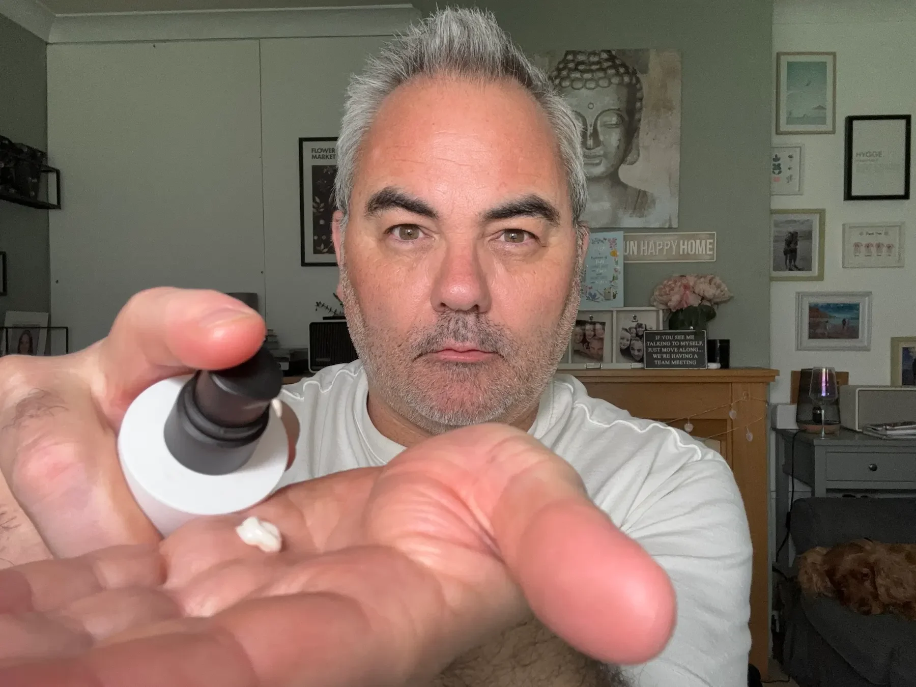 Jerome applying Beau Domaine The Fluid Cream to his hand, demonstrating the light texture of this anti-ageing moisturiser for men.