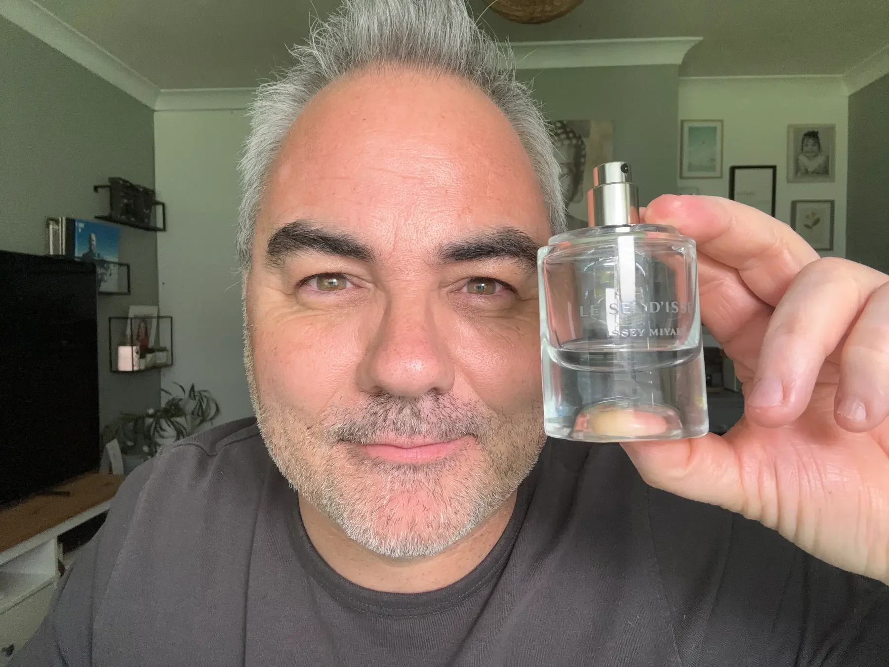 Jerome holding the new Le Sel d’Issey by Issey Miyake, reviewing its aquatic and woody scent profile for men over 50.