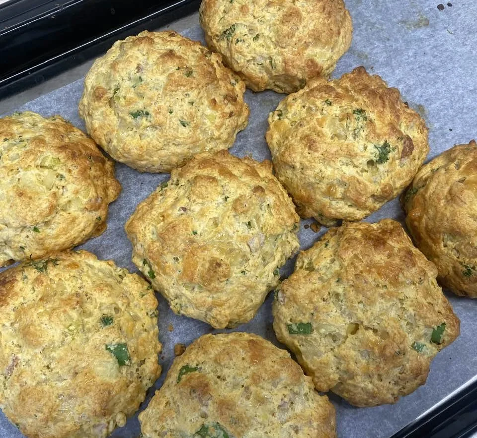 Baked savory scones on a baking sheet lined with parchment paper