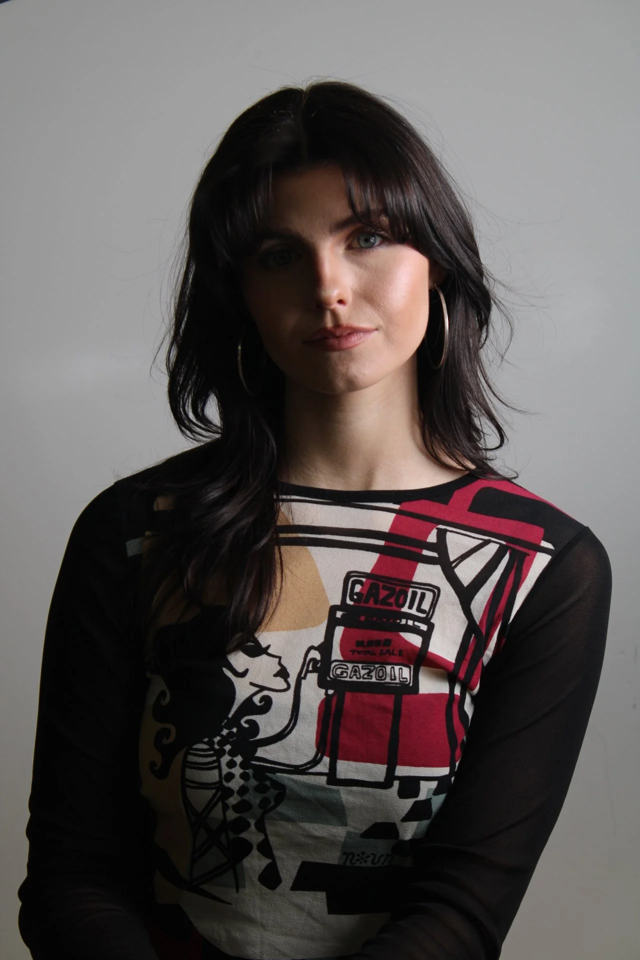 Woman posing in front of camera