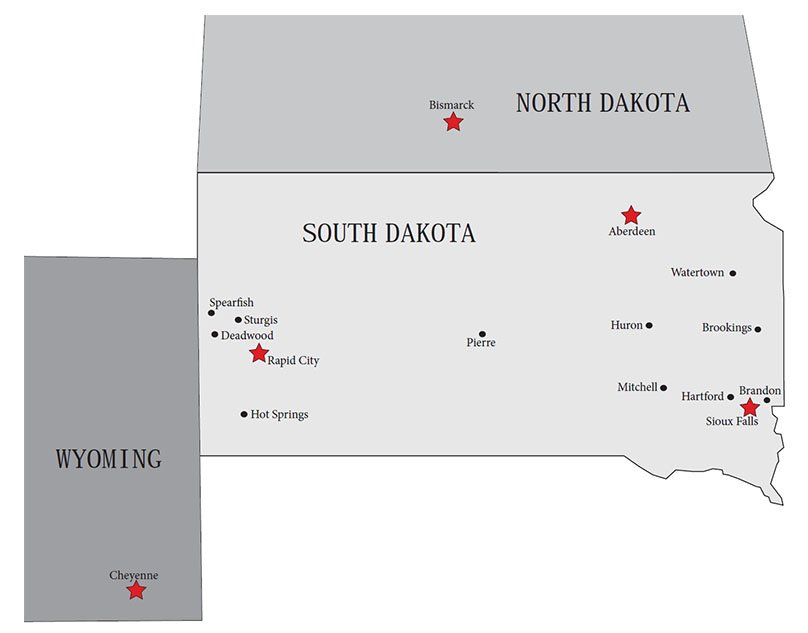 Map of South Dakota and neighboring states showing major cities and locations with red stars. Cities include Bismarck, Aberdeen, Rapid City, Sioux Falls, Brandon, and others.