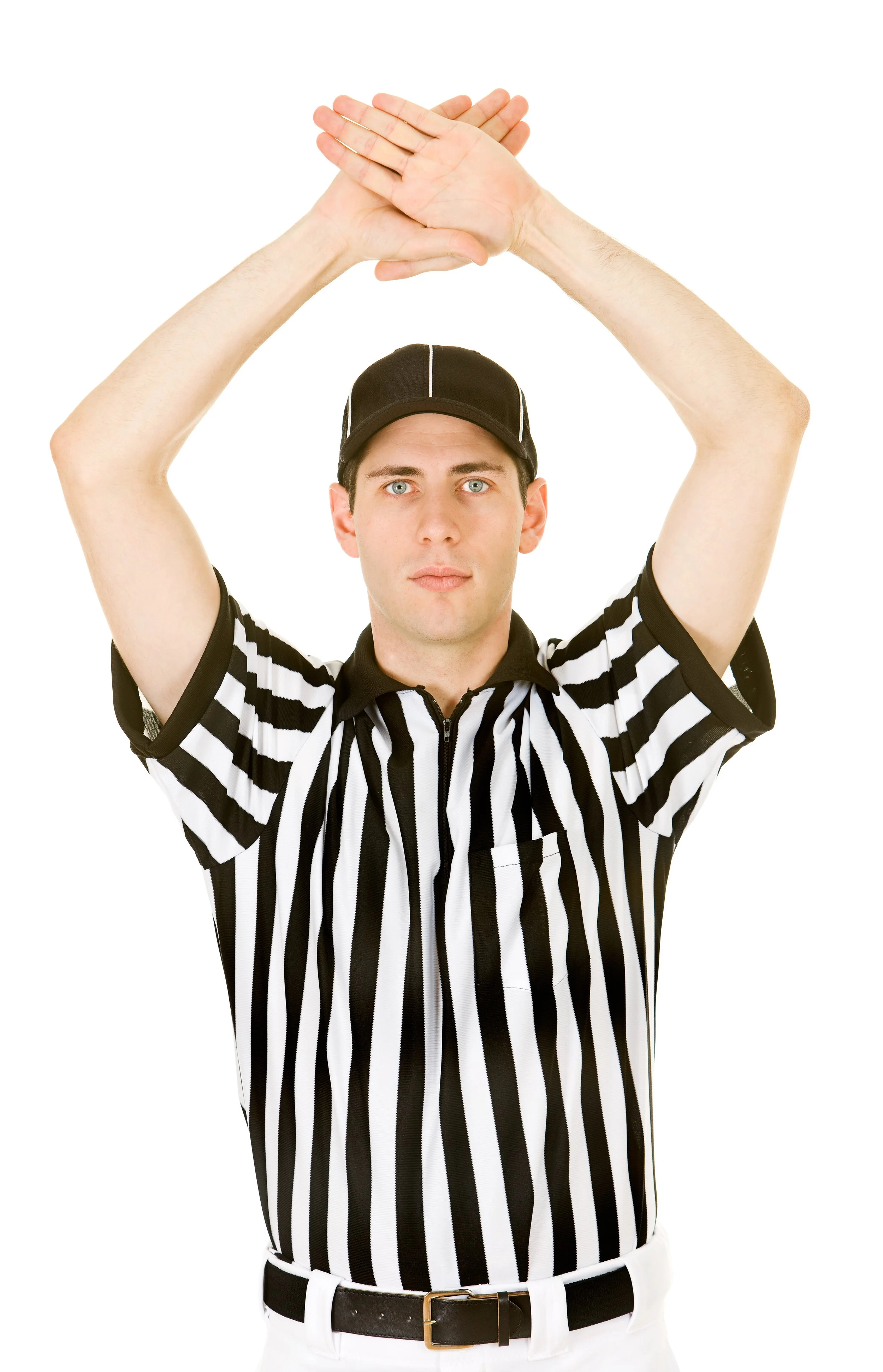 A young man dressed as a referee, wearing a black and white striped shirt, a black cap, and white pants with a black belt, is standing with his arms raised above his head and his hands clasped together.