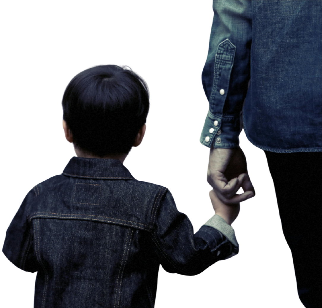 A child holding an adult's hand, both wearing denim jackets.