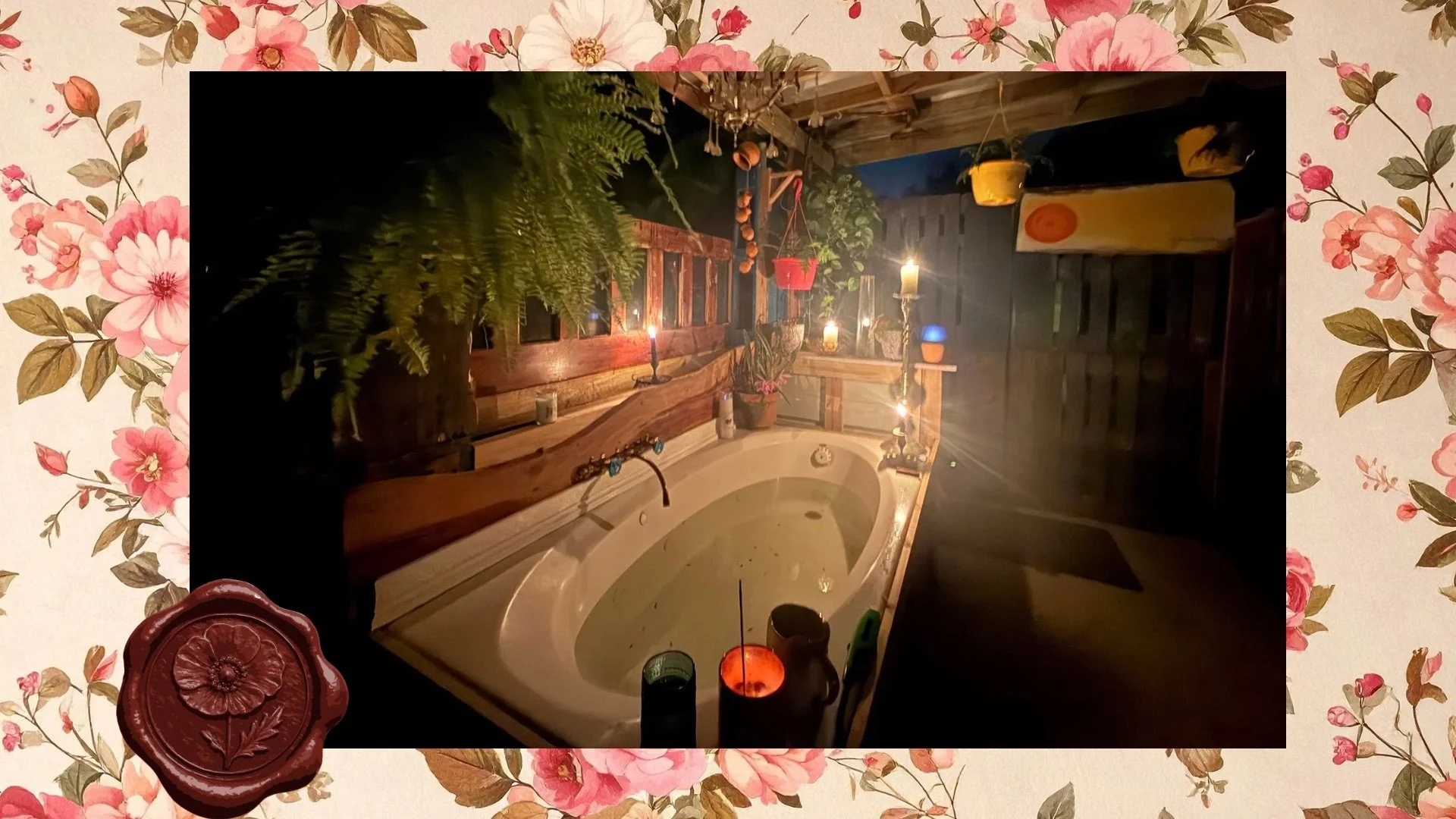 An outdoor hot tub or jacuzzi surrounded by candles and hanging potted plants on a wooden deck at dusk or night.