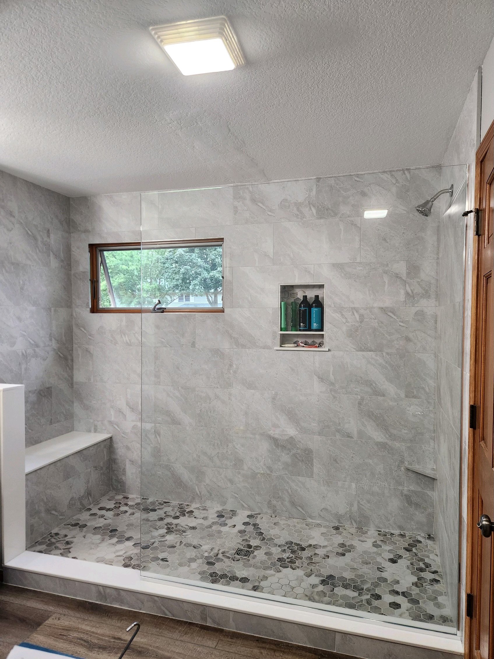 Custom frameless shower enclosure installed by LCC Enterprises in Virginia