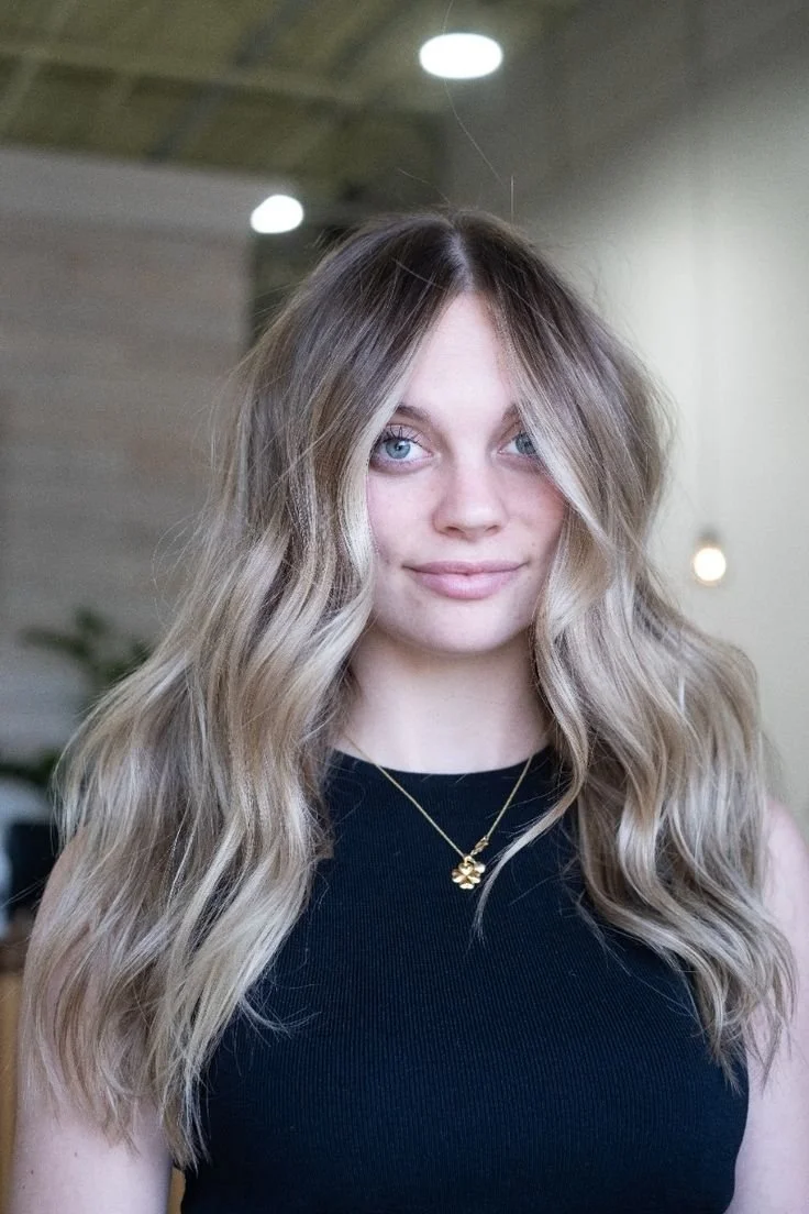 lived in blonde hair color with soft waves in exton pa salon