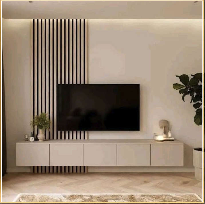 Modern living room wall with mounted flat-screen TV, white floating console beneath, decorative plants and objects, and vertical black wood slats as part of interior design.