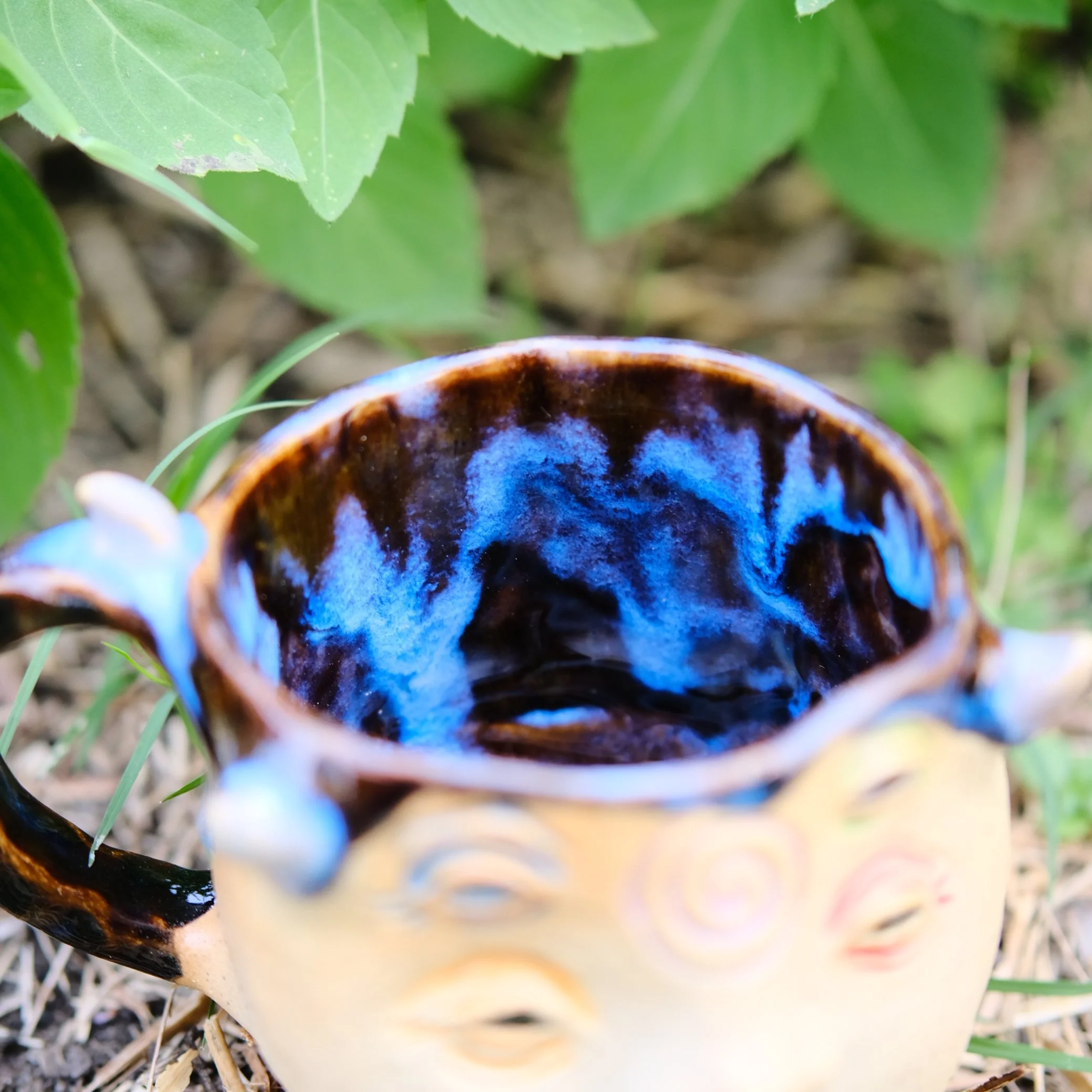 unique face mug with surreal all-seeing eyes design handmade pottery