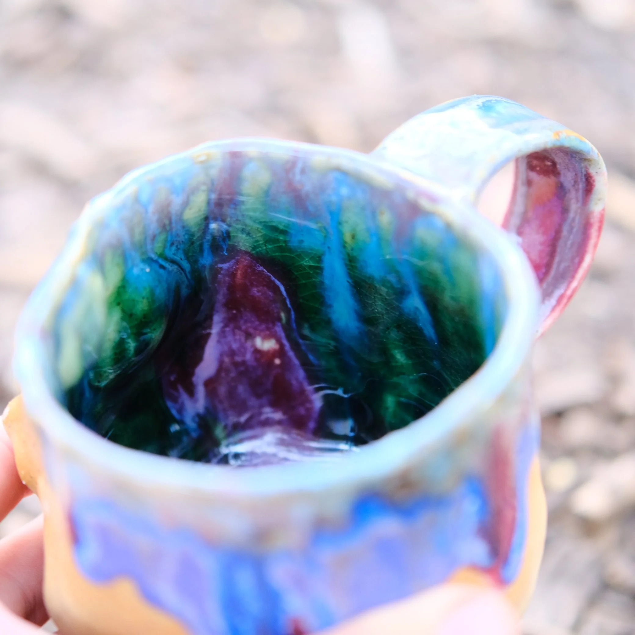 ceramic mug with three eyes face handmade australian pottery