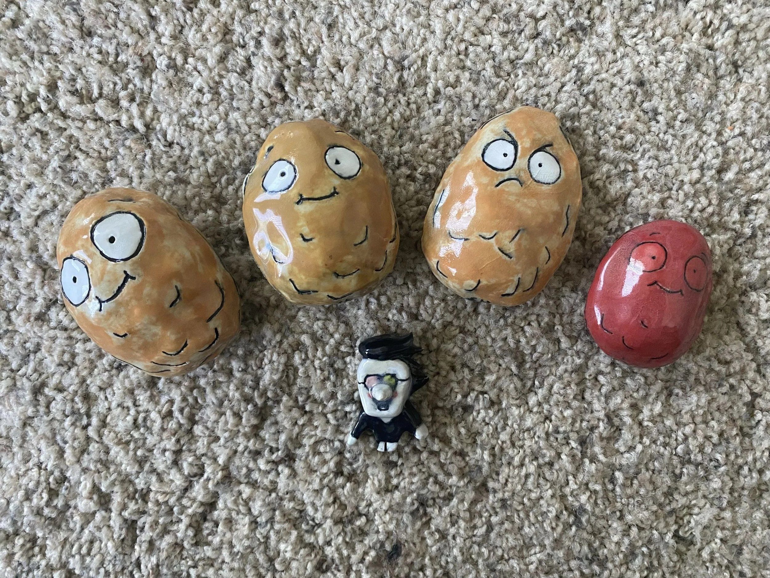 I ended up making a whole line of variants to go with him based on the game. I also varied the size of the clay balls inside to make different sounds based on the one you choose! Also pictured is a very cursed figurine I made of the Deltarune charact