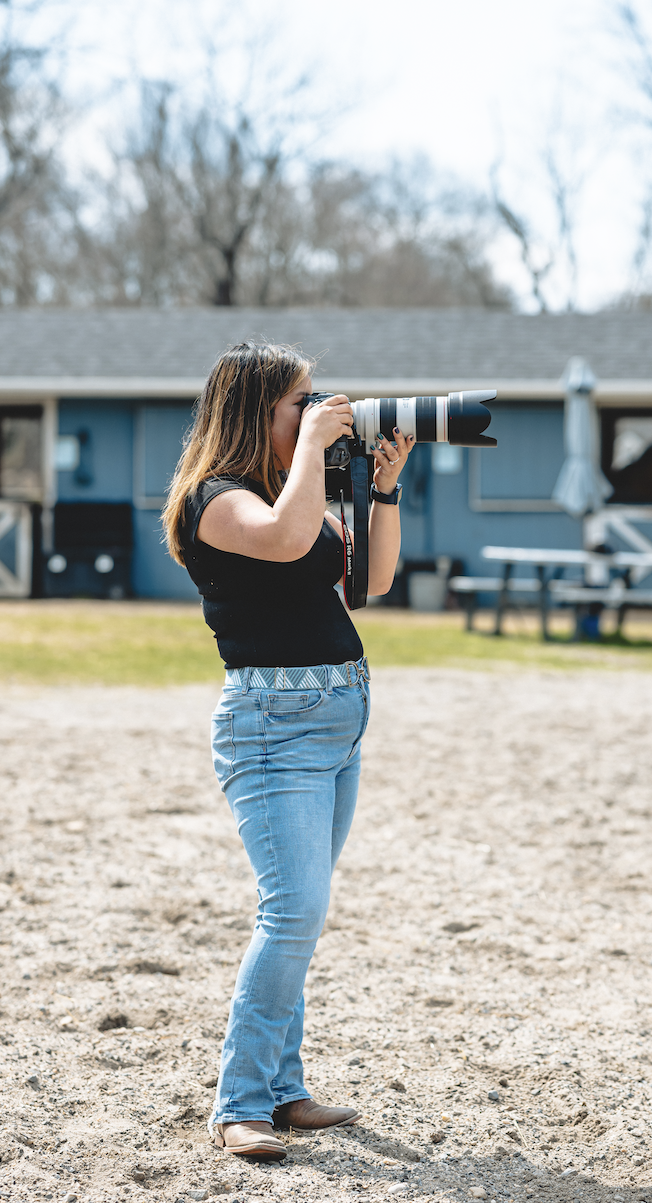 Frances Baldinucci posing with camera for branded photoshoot for Fran B Media