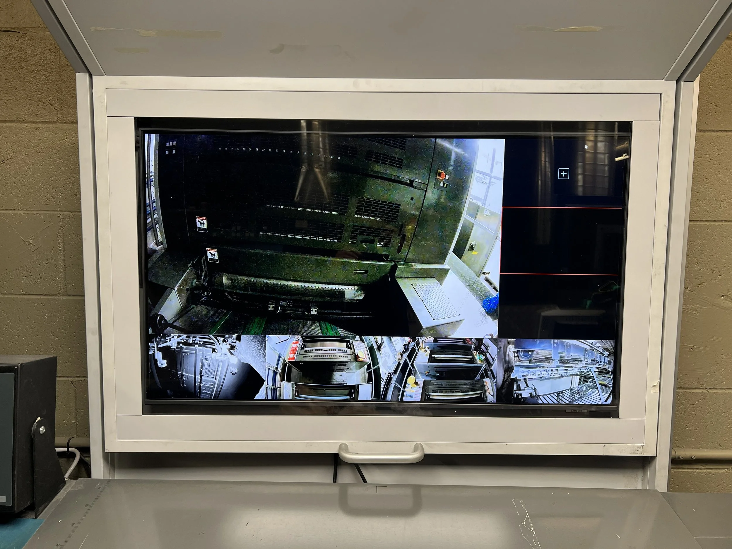 Security monitor showing multiple camera feeds. Access Control, automation, surveillance HIKCENTRAL project.