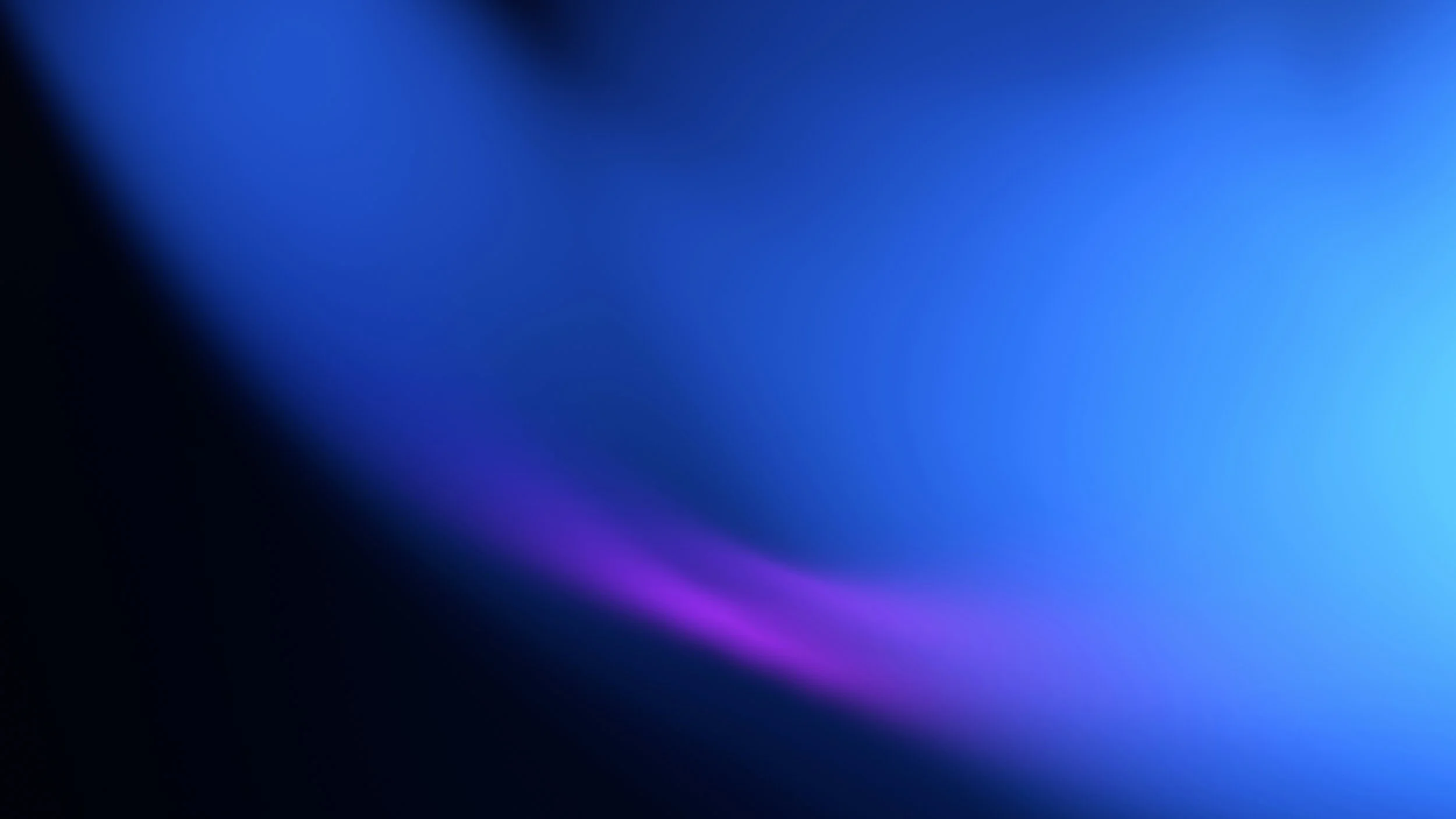 Abstract blue and purple gradient background with soft glow and blur effect.