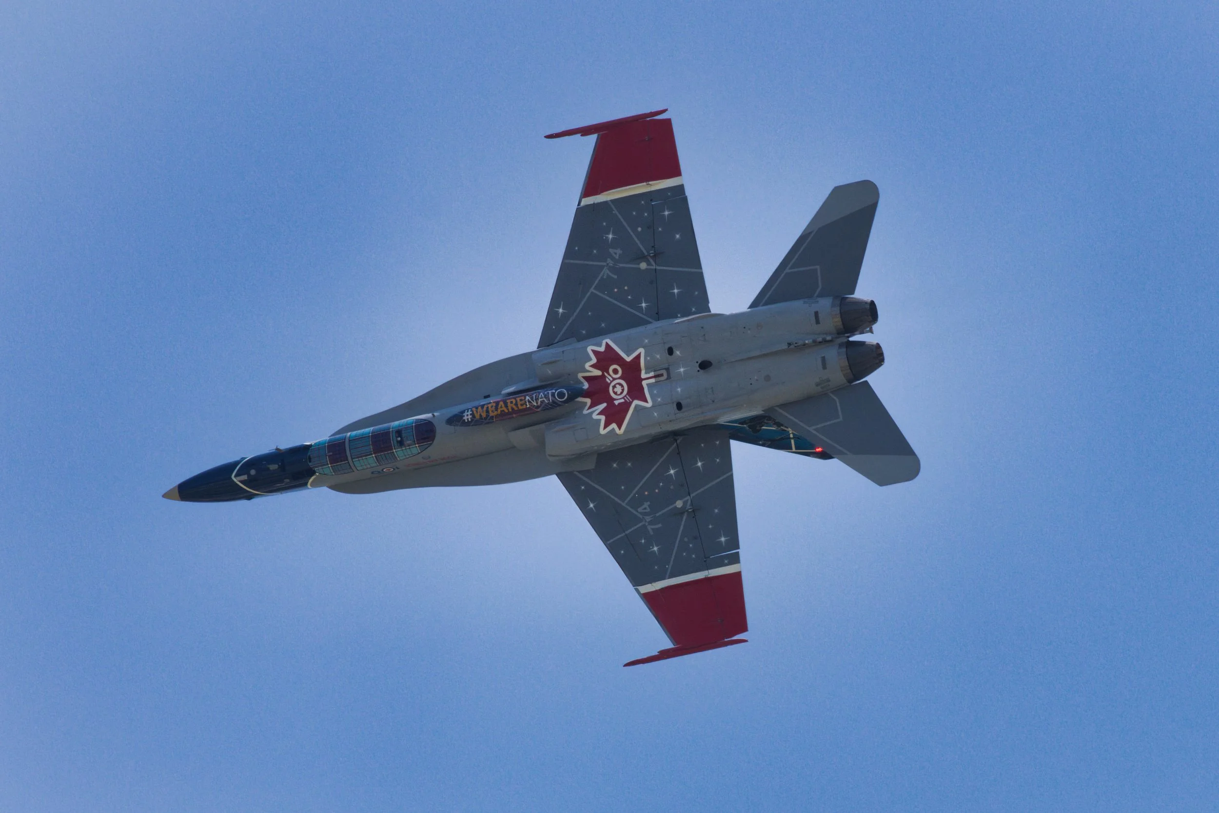 The F-18C of the Royal Canadian Air Force Demonstration Squadron heading into the break over EAA AirVenture 2024 in Oshkosh, WI.