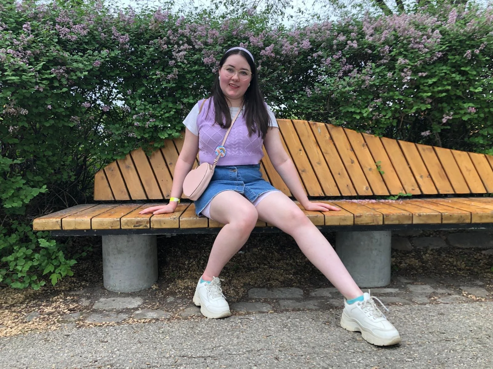 Maya sitting posed on bench